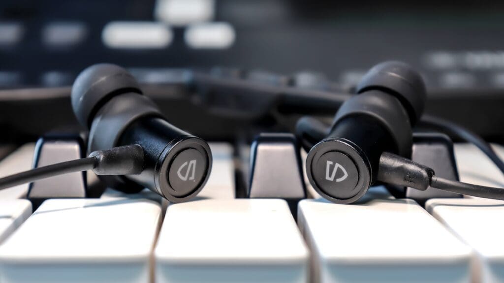The Soundpeats Q40 HD sitting on a piano